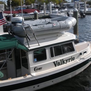 Just discovered that an inflatable can be put on a tall top not inverted.  I had always inverted before this.  Let's see those dinghy thieves try to get it this way quietly!  That's a Nordic Tug 26 tied up next to me.

A dock walker asked me if I really needed radar on an inflatable!