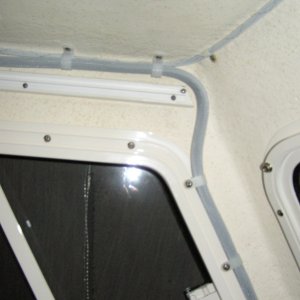 Across the roof line and down the "A" pillar then into the V-berth to the power & 740S unit.