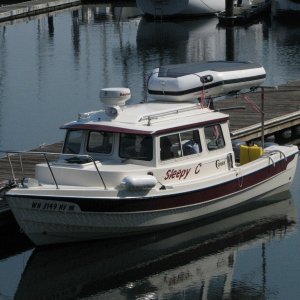 Finally with the inflatable rack on and the Wolverine up and in place.  Original, and, I like it.  Still working out the added aft weight and the anchor light  visibility from aft was marginal so a taller (36" LED All-around) was added.