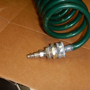 Plumbing bits to adapt standard faucet coil hose to my washdown receptacle.