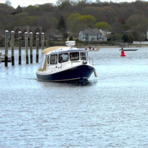 The Betty Ann arriving at its new home in Connecticut at Port Niantic. What great lines!  Note: If the port window looks kind of odd, it's because it is a piece of plexiglass taped to the hull with white shrinkwrap tape.  While Les was trailering our boat cross country, a passing vehicle threw up a stone, which crashed through 3/8" tempered glass!  What are the odds of that happening, and to such robust glass?   So it's going to be a few weeks before the glass is replaced.