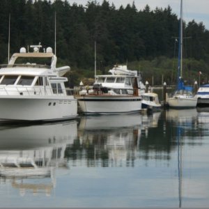 Our strategy at La Conner to avoid the remanants of that hurricane in September 2011--  nestle ourselves between large boats.  Can you find us? O.K. -- we were dwarfed by larger boats, but bigger is not better -- only bigger.  The boat in front us was owned by a wonderful couple, and afforded their entire family plenty of room.  However, their engine was not powerful enough to make it through Deception pass  against the tide like we can.  We can go anywhere.  There is a niche for everyone in boating.  We like having some of the conveniences of a large boat, but the power to take us just about anywhere safely (within reason), superior fuel economy, and shallow draft operation to navigate our rivers and gunkholes on the East Coast.