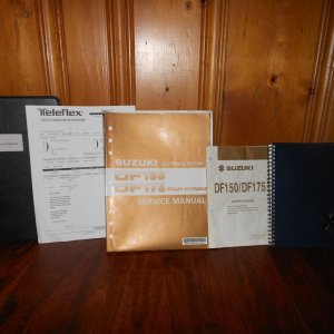 Dec 2013:  Detailed systems binder, upgraded Teleflex steering system receipt, Suzuki 150 'shop manual' ($60 value), engine quick reference guide, and log book with adventures and all service receipts.