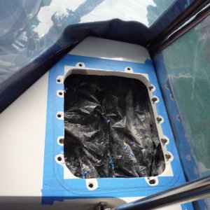 Black plastic bag to keep lazerate contents clean.
Blue painters tape to protect gel coat, mark out peremeter for inside and outside of hatch cover.