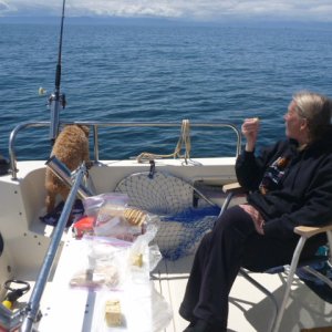 Jane fishing & Tucker guarding the fish.