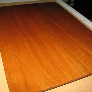 Media 'Board made utilizing some scraps to fill the hole from the Wallas (removed and sold).  Just some scrap 1/8" ply epoxied together to make 1/4", then cut out, some cleats stuck to the bottom side, and then varnished.' in album 'Sink cover board while varnishing.  I made a similar one (sans hole) for the cutout where the Wallas used to be.  It's surprisingly handy to be able to remove it to work on things (wiring etc.) under the galley, although I may eventually replace the whole galley counter and if so will likely make it a solid piece except for the sink cutout.'