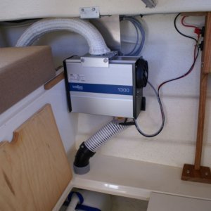Wallas 1300 Install - DSC06180.  Intake/exhaust installed. The heater warms the cabin nicely, whichever way the seats and table are configured.  The louvers on the vent can be turned to direct heat at the First Mate's feet, whichever seat she is in. Ducting could be added.