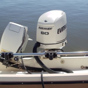 Stainless bar across motor well with three Scotty rod holders included. Two brand new holders never used.