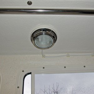 Completed overhead light.  Has two brightness levels.  Highest is good enough to conduct surgeries under!  It is very bright.