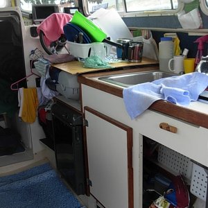 Two Bears in "living" mode.  The plywood sheet that covers the cabnet is now placed over the helm seat greatly expanding the work surface.