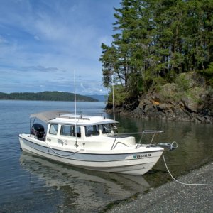 Nice day to attempt my first beach landing in the 22.  Actually is easier than the 16 due to the added length to keep the prop in deeper water, and wider width to get to the bow. Although the 16 is small enough to just tilt up and paddle in. C-Dorys are great boats.