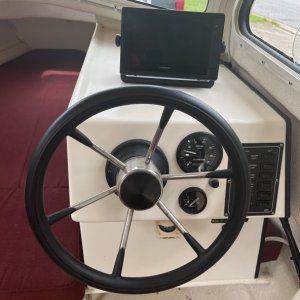 First thing I did was replace the old original fish finder with a Garmin touchscreen chart plotter.