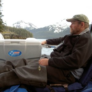 On a rare warm day relaxing on my West Marine chair, which is sitting on the fuel can container
