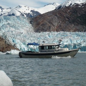 JoLee at the helm cruising through the ice burgs in front of South Sawyer Glacier