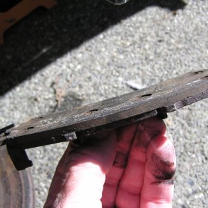 Same pad; nearly down to the rivets.  With the rust, it was just a matter of time until it began grinding.