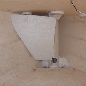 Below deck, there is a hawse pipe with an access hole in it by the lower thru-deck block that sends the anchor line aft under the V berth.  I'm putting the original EPS foam flotation back in place after insulating the through deck fittings for the pulpit.  The original EPS was just loose fitted, but I'm foaming them into place to help reduce the oil drum whanging sound of a fiberglass hull.