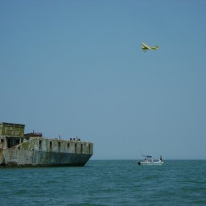 Pilot checking out the concrete boats and fishermen