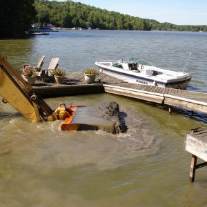 This about the only pic I can find of my "beater" a 1988 Rinker.  We call it the Dog Boat.  We had a bit of dredging in 2007.
