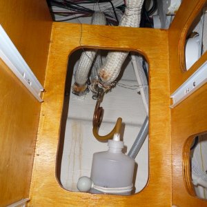10. Exhaust over flow collection bottle. I still get a little water getting past the heat resistant silicone used in the flex pipe to solid pipe connections, and possibly the flex pipe itself. I keep a synthetic towel folded under the cabinet drawer box, shown in this picture. The amount of water that collects in the towel and the bottle are minimal and now acceptable to me. It now takes pretty rough weather conditions to have salt water collect in these areas.
