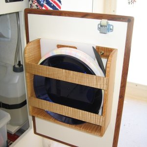 Right-hand cabinet door storage compartment.