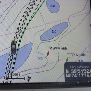 this picture taken almost at the same time as the previous shows the two cans shown to the right of our boats Icon well out our course and in fact in the position they are shown they are on top of a shallow sand bar. This is an expensive upscale Blue Chart G2 Vision chip