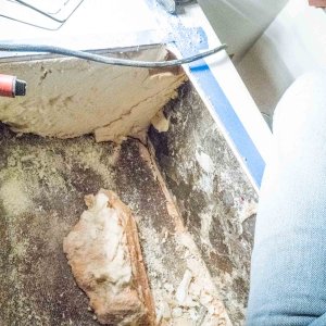 There was a huge glob of the mystery substance on the hull, on the port side of the portable toilet storage area. It was in the corner and broke away easily. It appears like someone dumped a pile of it on the hull, then lowered the berth section on top of it, and this was squeezed out. It was damp underneath.