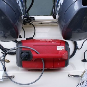 Gen Mount 011 - Engines clear generator in all positions - -
2014 UPDATE - When the platform was built, the boat had Yamaha F50's. We have since repowered with F70's. I feared that the slightly different shape of the F70's cowlings would prevent full tilt with the gen on the shelf, but it's not a problem!  Good to go.