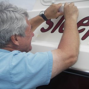 Lettering nearly fills the flat portion of the space.