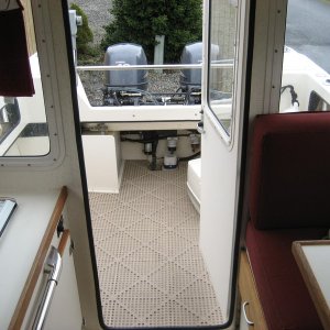 View from cabin to stern.  Wallas to starbd, table on port, porta-pottie hiding to port in cockpit.