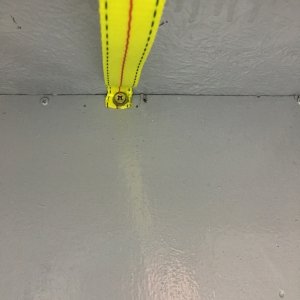 Tank hold-down strap installed.