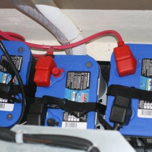 Three batteries (installed by the dealer) two starting batteries (34M Optima) and one 'house' battery (D34M Optima) located beneath the port forward dinette seat - behind the refrigerator.