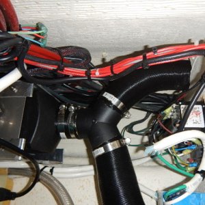 Media 'Output side of heater.Added a Y connection to run to V berth.' in album 'View from behind fridge looking up under gunnel'