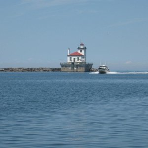 We saw a weather window for crossing Lake Ontario from Oswego New York to Kingston Ontario.  We got to the Light House at Oswego about 2pm and headed out for Kingston - about 60 miles across Lake Ontario.  Its a long trip for the guys in the big trawlers.  The CD25 did it in a little over 2 hours