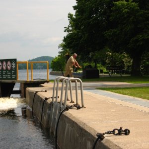 Most of the locks on the Trent Severn are run manually, the Lockmaster is turning the handles to open the lock door