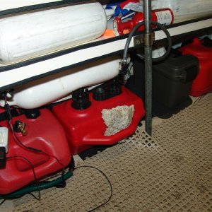 21 gallons of fuel with quick disconnects, toolbox, 4 dock bumpers, 2 sponges, 2nd fire extinguisher, inflatable ball, 2 collapsable paddles, 1 small wood paddle, 2nd anchor, utility knife, hand bilge pump and electric bilge pump in there.