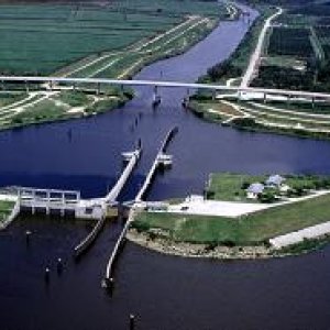Port Mayac Locke: Lock chamber:56'x400'- Vertical lift: Diffenence between St. Lucie Canal water level and Lake Okeechobee 1/2' to 2' (sometimes it is a "pass thru")- Discharge capacity 14,800 cfs(cubic feet per second)Operates daily 6:00A to 9:30P-Marine VHF radio Channel 13-Located at Okeechobee Waterway 
statute mile 39.0