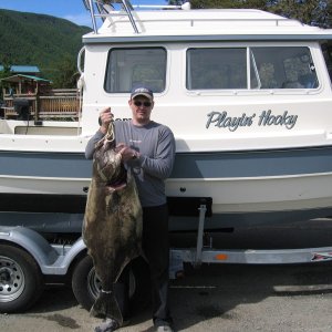 My bro and his 52\" Halibut.