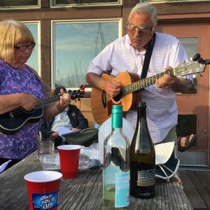 Patty and Pat leading the sing-along after the potluck on Saturday night