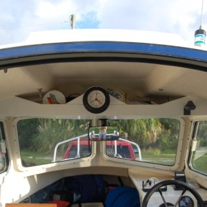 Overhead shelf in 16 with Tide Clock. Tide clock is a very useful item in my part of the country.