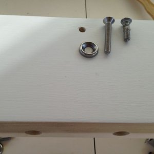 Stainless screws will go through shelf and mount into roof rack.  New screws (left) are longer than the old screws (right).