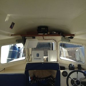 Old shelves removed except for manufacturer shelf above helm