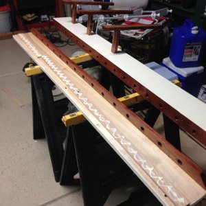 New ceiling shelves.  Without shims, shelves angled slightly up and did not sit flat.  I glued shims above the three mounting holes which fixed the problem.