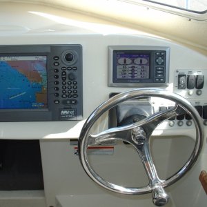 Furuno Navnet Radar-Plotter-Fishfinder and Mercury Vessel View Display.  Also added stainless Edson Wheel with Power Knob.