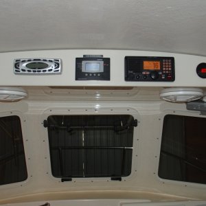 Built larger overhead console so that it is supportd by two bolts on each side and deep enough to handle 10" speakers.  Unit was gelcoated to look like factory finish.