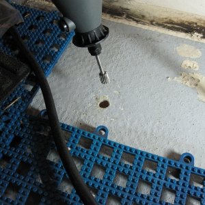 Somebody somewhere suggested this as an alternative to a bent nail or allen wrench. Very quick and smooth. Simply let the shaft ride against the laminate and proceed around the hole. A perfectly undercut cavity!