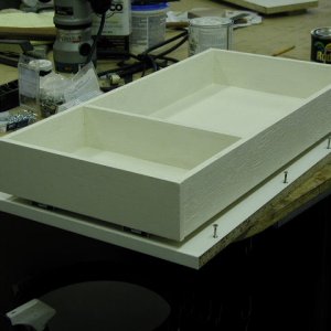 One of two sliding drawers. Tracks on bottom of drawer.