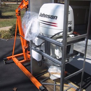 March 2003 Here's the new Johnson 4stroke in it's steel rack after I striped the cardboard away.