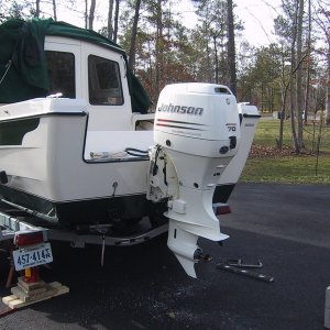 Late in the after noon, we have it bolted up right where we wanted it, with the ventilation plate 1/8" below the bottom of the boat. Thanks family for helping me do a job well done.