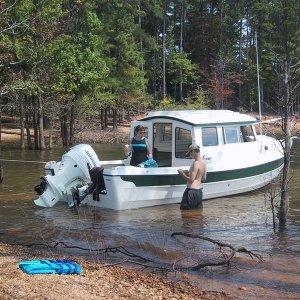 Here's the crew, the boy is begging food from Mama, there's a little black beagle running around here somewhere too. At Buggs Isl. Lake, Va.-NC. Water temp. 87*