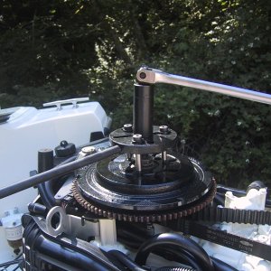 OMC tools, pop flywheel off tapered shaft.